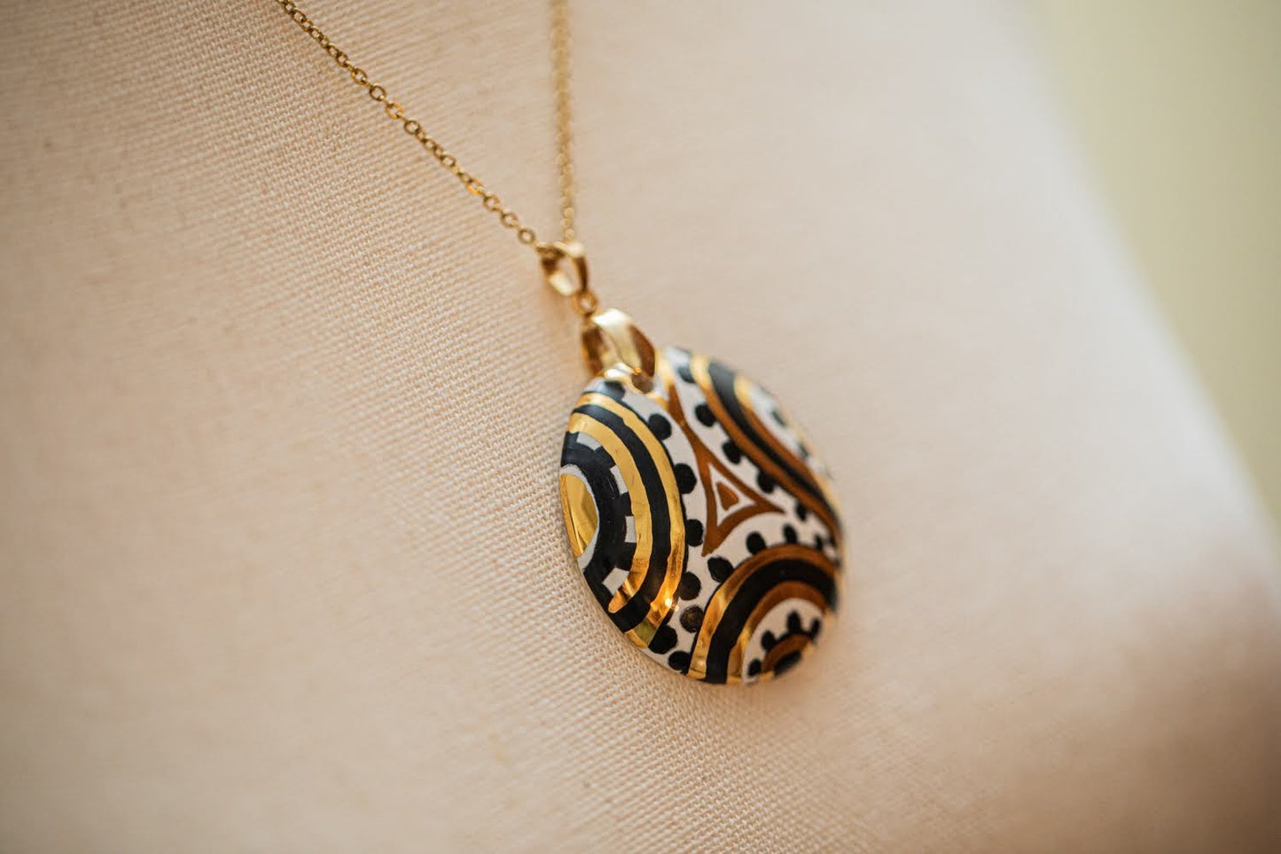 Linea LUXURY Black and Gold Swirl Small Round Necklace with Pure Gold Insert